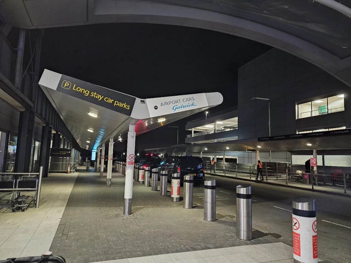 Signs and the exterior approach to Gatwick Airport South Terminal