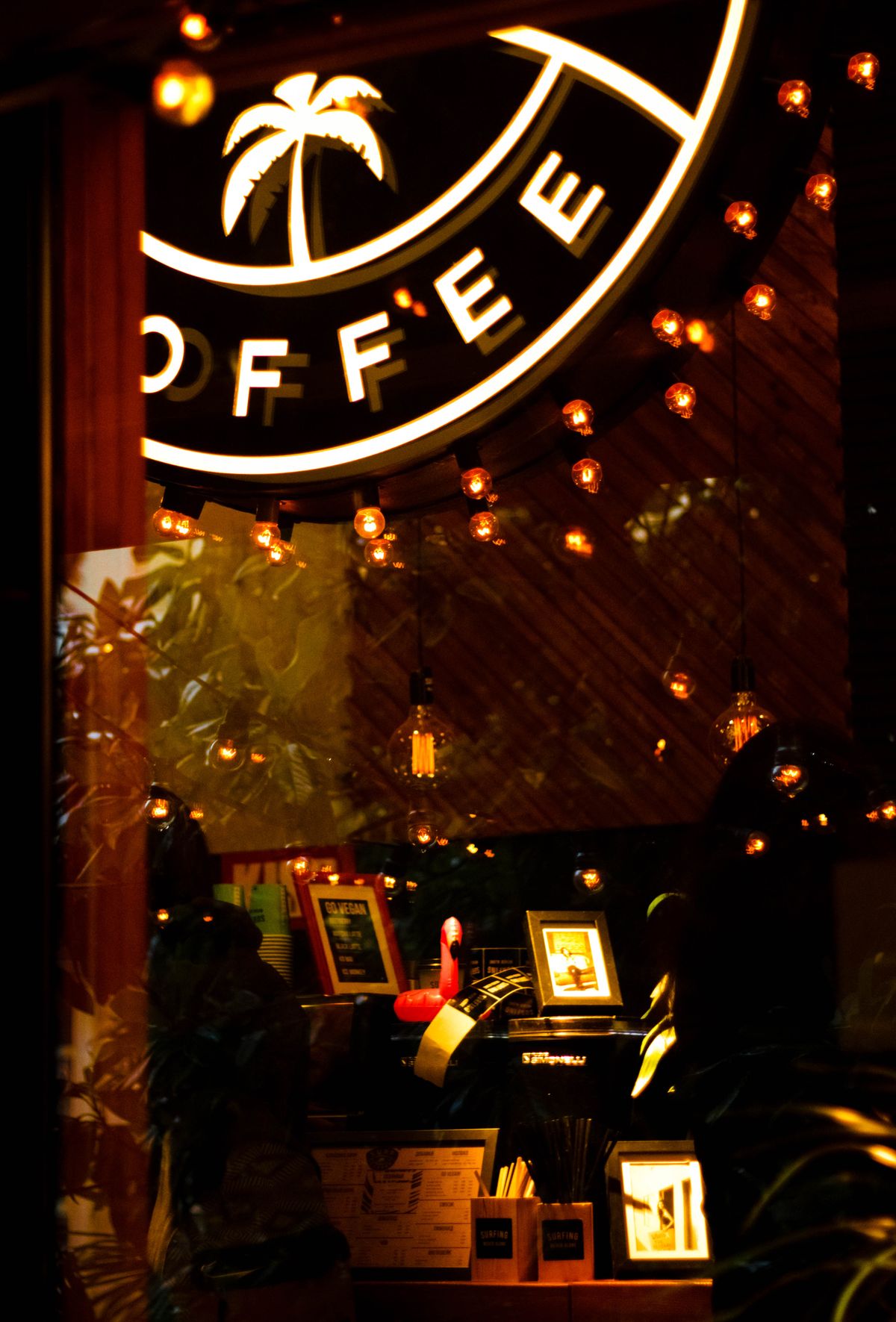 The interior of a busy independent café with customers at tables — the kind of standard-tier premises Martyn's Law is written around.
